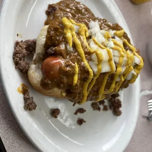a chili dog with mustard