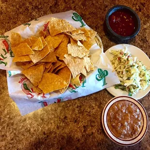 Yummy chips, beans, salsa, and spicy cabbage!