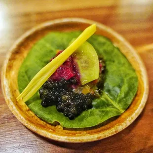 Swiss chard leaf with sturgeon caviar and bagoong