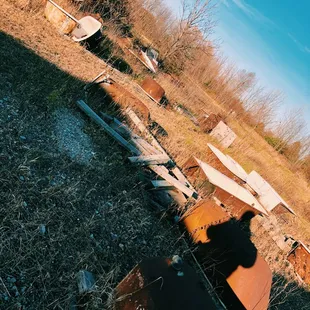Lots of cool tub and sink options out back! They also have a lot of doors, shutters, and windows stacked against the building to browse!