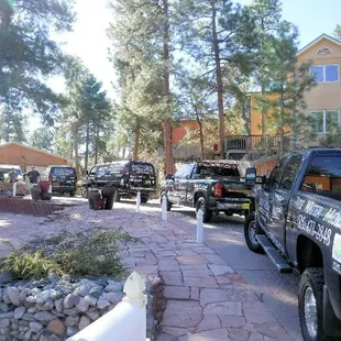 several vehicles parked in a driveway