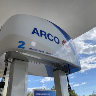 a gas station with a sign that says no smoking