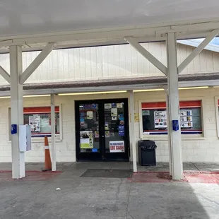 the entrance to a convenience store