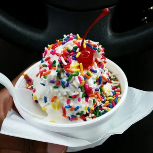 Hot caramel sundae with rainbow sprinkles. Yum!