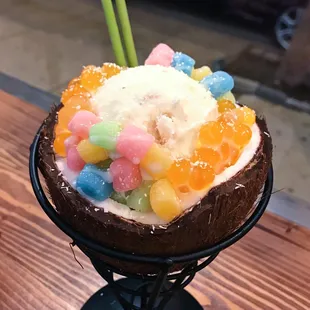 an ice cream sundae topped with fruit