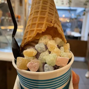 Taro ice cream with a vanilla drizzle and marshmallows