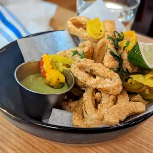 January 17, 2023; Crispy calamari w. old bay, pickled market peppers, avocado green sauce ($ 12 for HH).