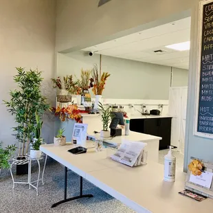 a table with flowers and a menu on it