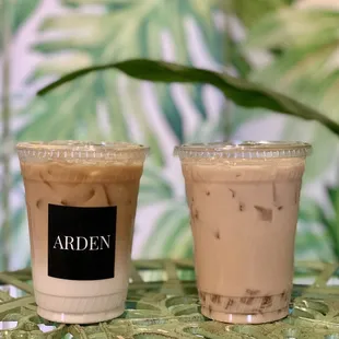 two cups of iced coffee on a table