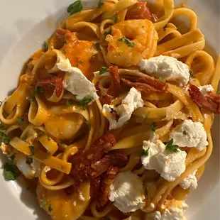 Mediterranean Goat Cheese Shrimp Pasta:  Shrimp, goat cheese, basil &amp; sun-dried tomato tossed in pomodoro cream sauce