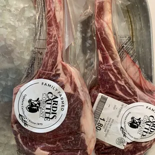 two raw lambs in a tub of ice