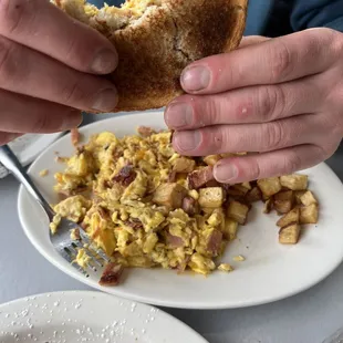 The scramble (scrambled eggs add cheddar onions pork roll)