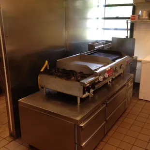a commercial kitchen with stainless steel appliances