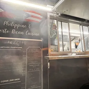 a food truck with a menu on it