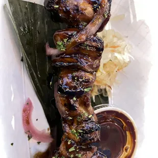 a close up of a meat skewer