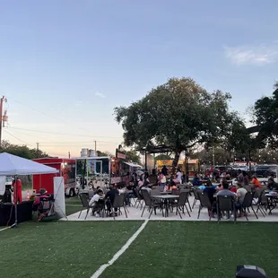 a crowd of people sitting at tables