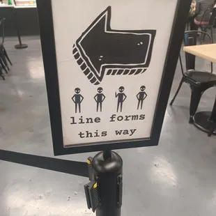 this way sign