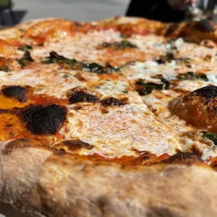 a close up of a pizza on a table