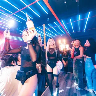 a group of people dancing in a club