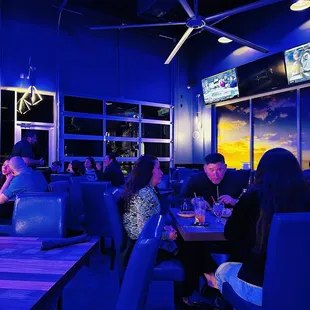 a group of people sitting at a table