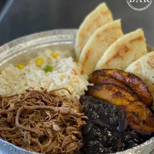 pulled pork, rice, and beans in a tin