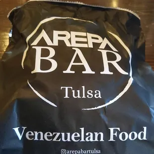 To go pocket wraps with Arepa Bar logo