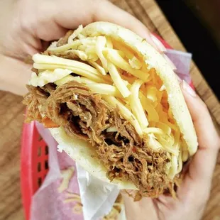Arepa with shredded beef and Gouda cheese
