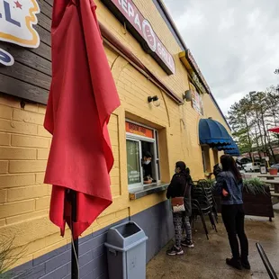 Outside ordering window. Located on the northwest corner of Plaza Fiesta. Exterior storefront.