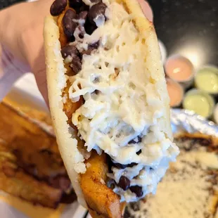 Arepa Pabellon. Shredded beef, sweet plantain, black beans, shredded white cheese. $7.99. Grilled white corn pocket.