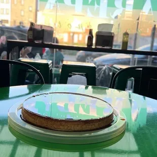 a green table with a cake on it