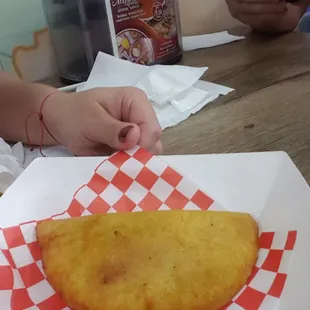 Empanada mechada, as big as your hand