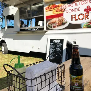 a beer and a basket of food