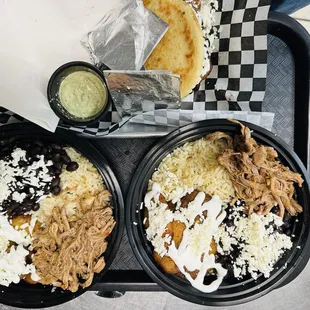 Pabellón bowl  Fresh black beans, hand pulled flank steak, rice and sweet fried plantains with fresco cheese and crema.