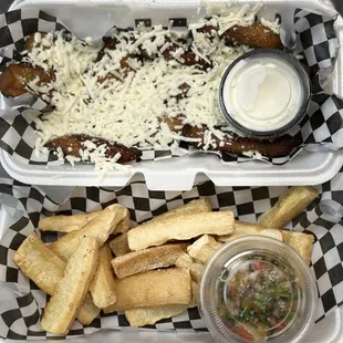Yuca fríes with house made fresh mango chimichurri, and our house made cilantro and avocado sauce.