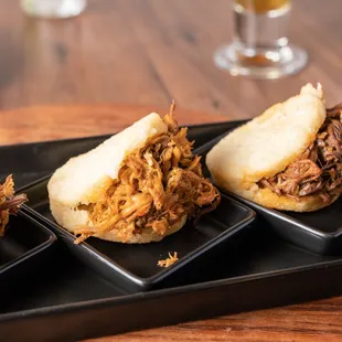 three plates of pulled pork sandwiches