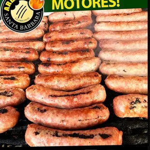 a bunch of sausages on a grill