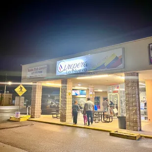 people standing in front of a store