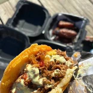 Urbanite arepa- braised beef, onions, peppers, and mozzarella with mild sauce