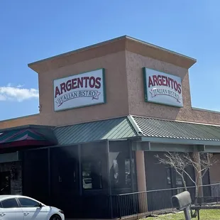 a car parked in front of a restaurant