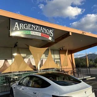 a car parked in front of a restaurant