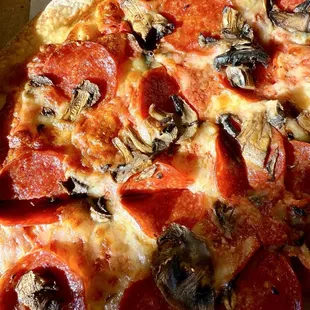 Medium Argenziano's pepperoni and mushroom pizza.
