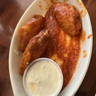 Chicken wings original sauce/ we ate 3 before I took the pic! There are other sauces to choose from as well. Ranch was great!