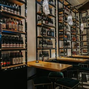 a row of wine bottles in a wine shop