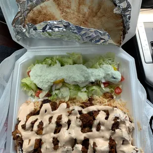 a wrap and salad in a styrofoam container