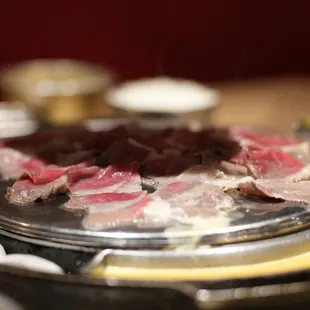 a close up of a plate of meat