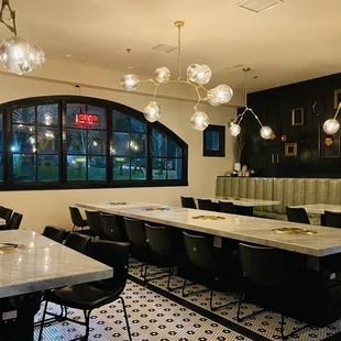 a dining room with tables and chairs