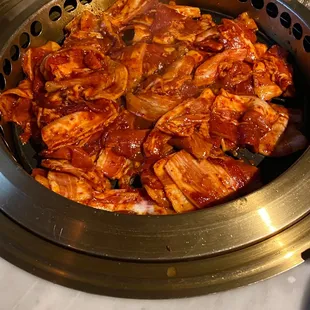 Cooking 5 portions of spicy pork belly included aa part of the feast $42 a person