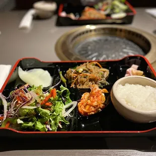 a plate of food and a bowl of rice