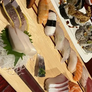 various types of sushi on a cutting board