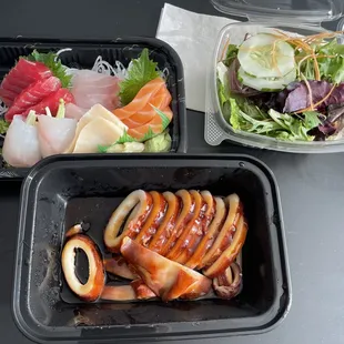 two take out containers of food